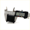 Black rectangular plastic stabilizer bush being measured by digital caliper for toyota hilux 1984-1988