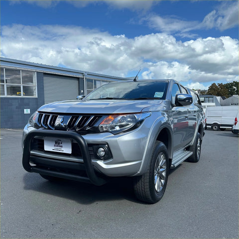 Silver mitsubishi triton with matte stainless steel nudge bar and black bumper guard from 2015-2018 model
