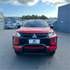Red mitsubishi triton 2019-2023 with stainless steel medium size nudge bar black bumper guard and roof rack