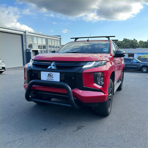 Red mitsubishi triton pickup with stainless steel medium size nudge bar black bumper guard and roof rack compatible 2019-2023