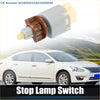 Gray and brown plastic stop lamp switch with yellow tip for Toyota Tacoma 4Runner 2005-2019 shown from back side