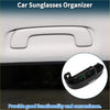 Black plastic sunglasses case for Toyota C-HR with sleek curved design and adjustable clamps to hold eyewear securely