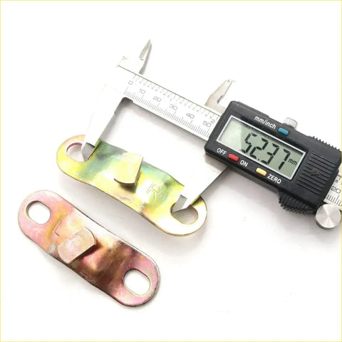 Metallic gold-toned tail gate side link lock bracket for toyota hilux n80 rn85 rn105 rn110 with textured surface and holes measured by caliper