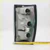 Back side of black plastic tail light light chrome edge assembly with wiring for mazda b2000 b2200 b2600 1985-1998