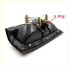 Backside of a black plastic tail light for Mitsubishi L200 Strada Colt Dodge Ram 50 with three gold bulb sockets and 5-pin connector