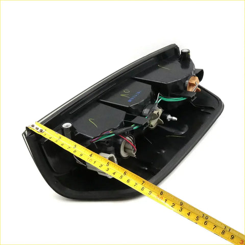 Backside of black plastic tail light light smoke lens with visible wiring for nissan navara d40 2005-2015 x2