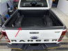 Back view of a white ford ranger xlt with black textured plastic tailgate cover for px1 2 3 models 2012-2021