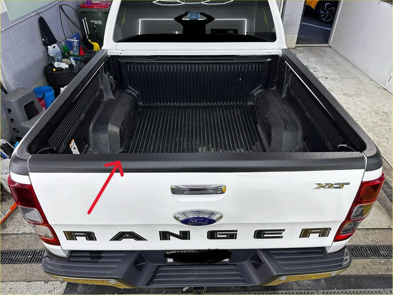 Back view of a white ford ranger xlt with black textured plastic tailgate cover for px1 2 3 models 2012-2021