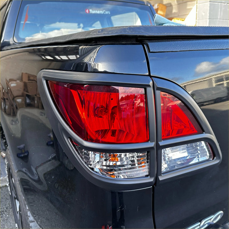 Black plastic taillight covers with red and clear lenses for mazda bt 50 2012-2020 matte black shown from back side
