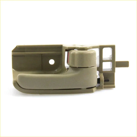 Beige plastic tan door handle bezel with integrated latch for Toyota Hilux SR5 2004-2013 shown from back side