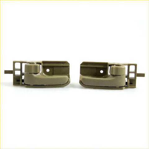 Pair of olive green plastic door handles with bezel for toyota hilux sr5 in tan color shown from back side