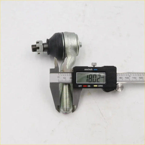 Silver metal tie rod end outer ball joint with black rubber boot measured by digital caliper for nissan d21 d22
