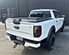 White ford ranger xlt pickup truck with black accents and textured hardlid bed cover from tomahawk hardlid next gen ranger