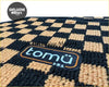 Black and beige checkered tomo orange floor mat with tomü brand patch for car interiors