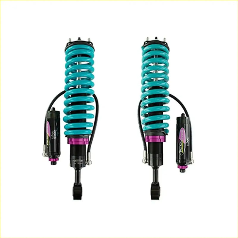Teal and purple dobinsons monotube remote reservoir coilover shocks with black components for toyota hilux n70 back view