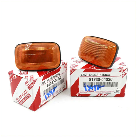 Orange rectangular turn signal light for toyota hilux 1997-2005 with black plastic housing and ribbed lens