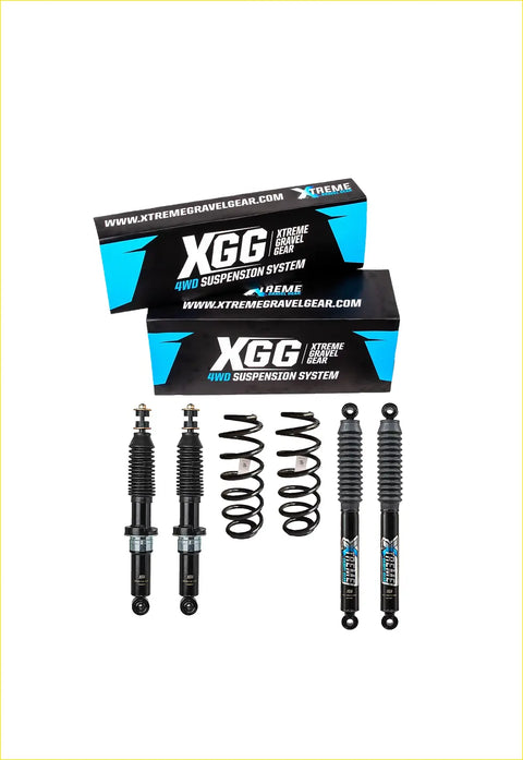 Black xgg 4wd suspension system components with coiled springs and shocks in front of branded mountain series packaging